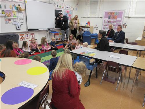 Image of the state superintendent in a Pre-K classroom observing instruction time.