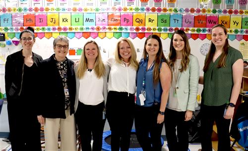 The GCPS Teacher of the Year, Kaitlyn Bolyard, poses with administrators.