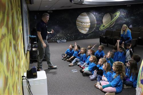 Image of students receiving instruction inside the Planetarium of Hickory.